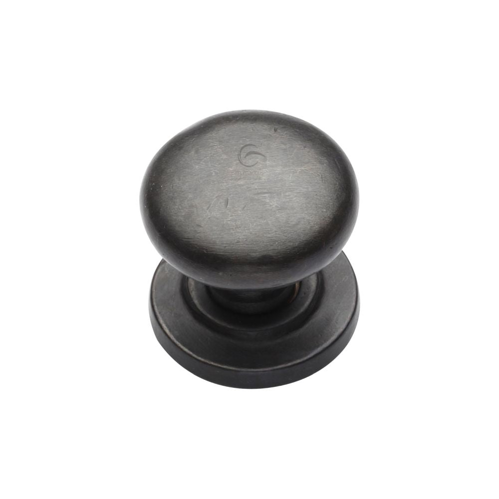 This is an image of a M.Marcus - Rustic Dark Bronze Cabinet Knob Round Design on Rose 25mm, rdb613-25 that is available to order from T.H Wiggans Ironmongery in Kendal.
