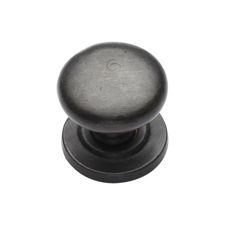 This is an image of a M.Marcus - Rustic Dark Bronze Cabinet Knob Round Design on Rose 32mm, rdb613-32 that is available to order from T.H Wiggans Ironmongery in Kendal.