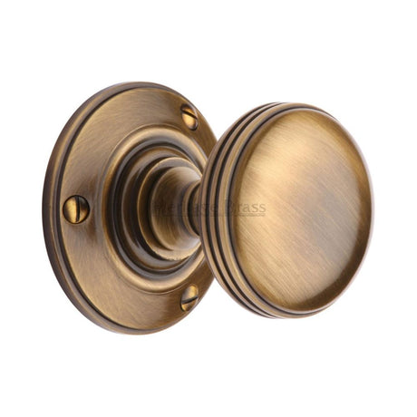 This is an image of a Heritage Brass - Mortice Knob on Rose Richmond Design Antique Brass Finish, rhm988-at that is available to order from T.H Wiggans Ironmongery in Kendal.