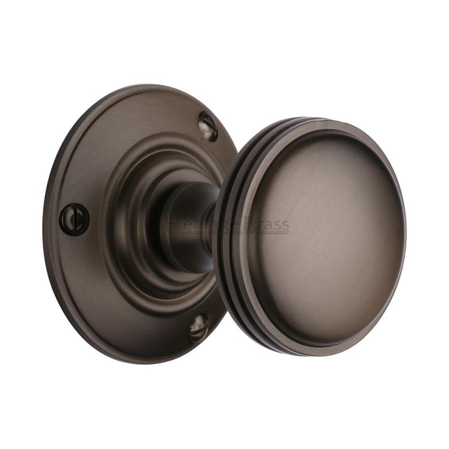 This is an image of a Heritage Brass - Mortice Knob on Rose Richmond Design Matt Bronze Finish, rhm988-mb that is available to order from T.H Wiggans Ironmongery in Kendal.