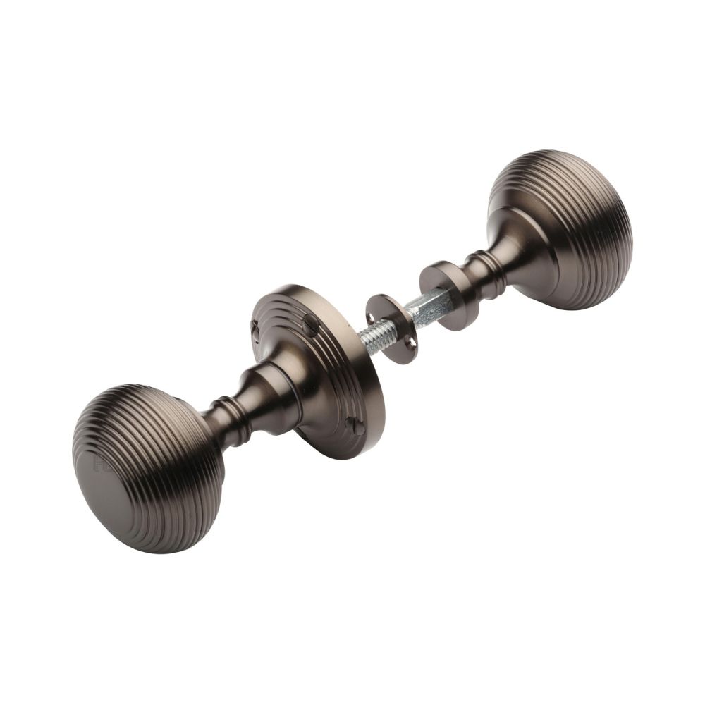 This is an image of a Heritage Brass - Reeded Rim Knob Matt Bronze Finish, rim-v971-mb that is available to order from T.H Wiggans Ironmongery in Kendal.