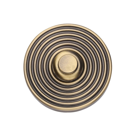 This is an image of a Heritage Brass - Reeded Bell Push Antique Brass finish, rr1186-at that is available to order from T.H Wiggans Ironmongery in Kendal.