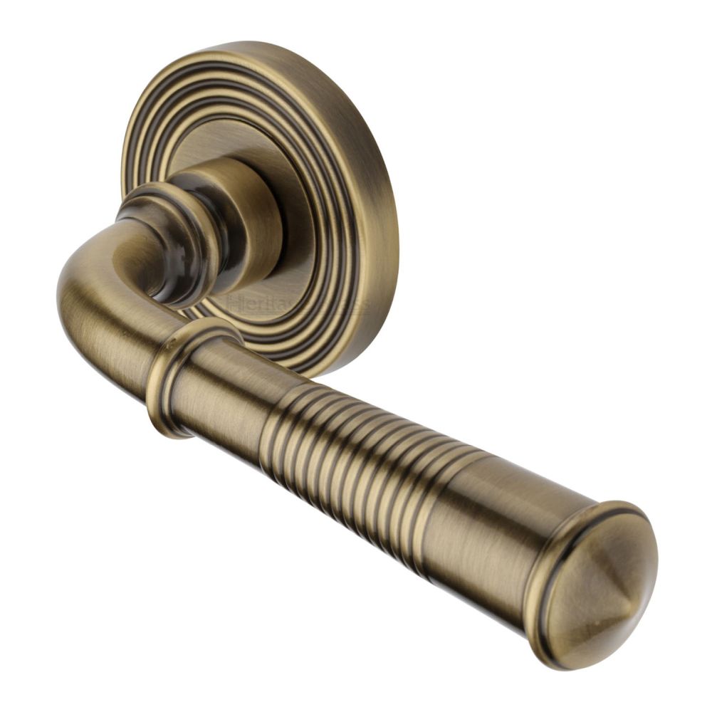 This is an image of a Heritage Brass - Door Handle Lever Latch on Round Rose Bridgetown Reeded Design, rr1935-at that is available to order from T.H Wiggans Ironmongery in Kendal.