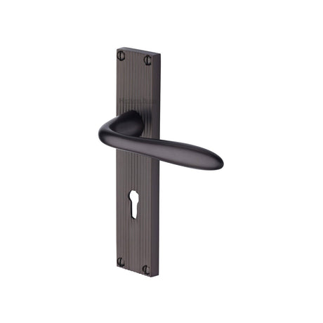 This is an image of a Heritage Brass - Sutton Reeded Lever Lock Matt Bronze finish, rr5000-mb that is available to order from T.H Wiggans Ironmongery in Kendal.