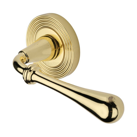 This is an image of a Heritage Brass - Door Handle Lever Latch on Round Rose Roma Reeded Design Polished B, rr7156-pb that is available to order from T.H Wiggans Ironmongery in Kendal.
