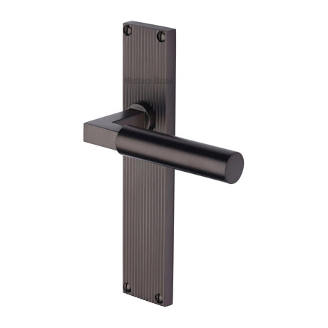 This is an image of a Heritage Brass - Bauhaus Reeded Lever Latch Matt Bronze finish, rr7310-mb that is available to order from T.H Wiggans Ironmongery in Kendal.