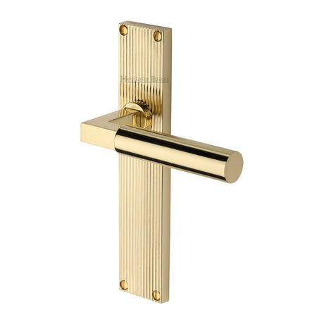 This is an image of a Heritage Brass - Bauhaus Reeded Lever Latch Polished Brass finish, rr7310-pb that is available to order from T.H Wiggans Ironmongery in Kendal.