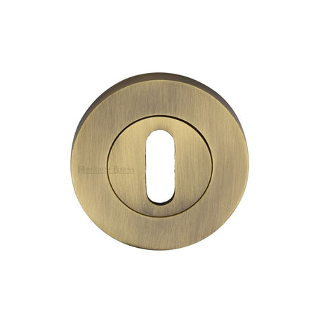 This is an image of a Heritage Brass - Key Escutcheon Antique Brass Finish, rs2000-at that is available to order from T.H Wiggans Ironmongery in Kendal.