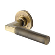 This is an image of a Heritage Brass - Door Handle Lever on Rose Signac (Knurled Bauhaus) Design Antique, rs2260-at that is available to order from T.H Wiggans Ironmongery in Kendal.