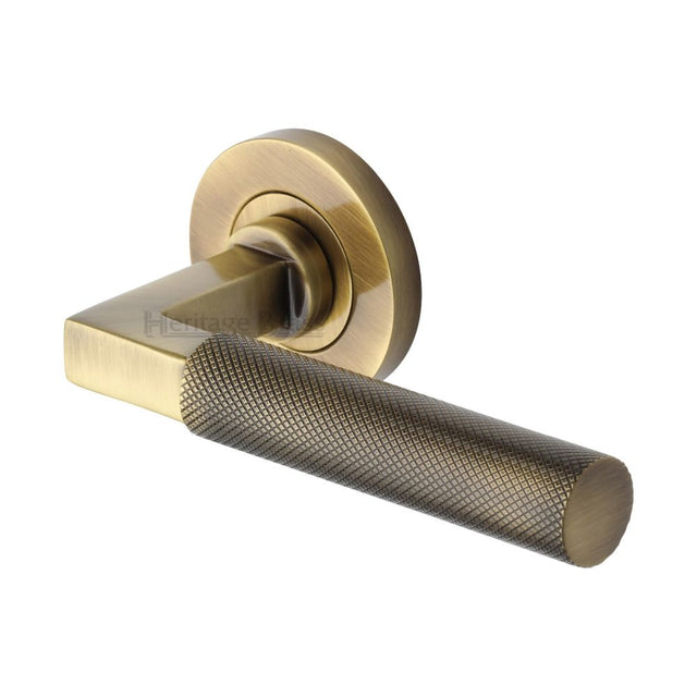 This is an image of a Heritage Brass - Door Handle Lever on Rose Signac (Knurled Bauhaus) Design Antique, rs2260-at that is available to order from T.H Wiggans Ironmongery in Kendal.