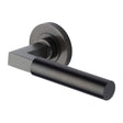This is an image of a Heritage Brass - Door Handle Lever on Rose Spectral Design Matt Bronze Finish, rs2261-mb that is available to order from T.H Wiggans Ironmongery in Kendal.