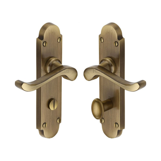 This is an image of a Heritage Brass - Door Handle for Bathroom Savoy Design Antique Brass Finish, s620-at that is available to order from T.H Wiggans Ironmongery in Kendal.