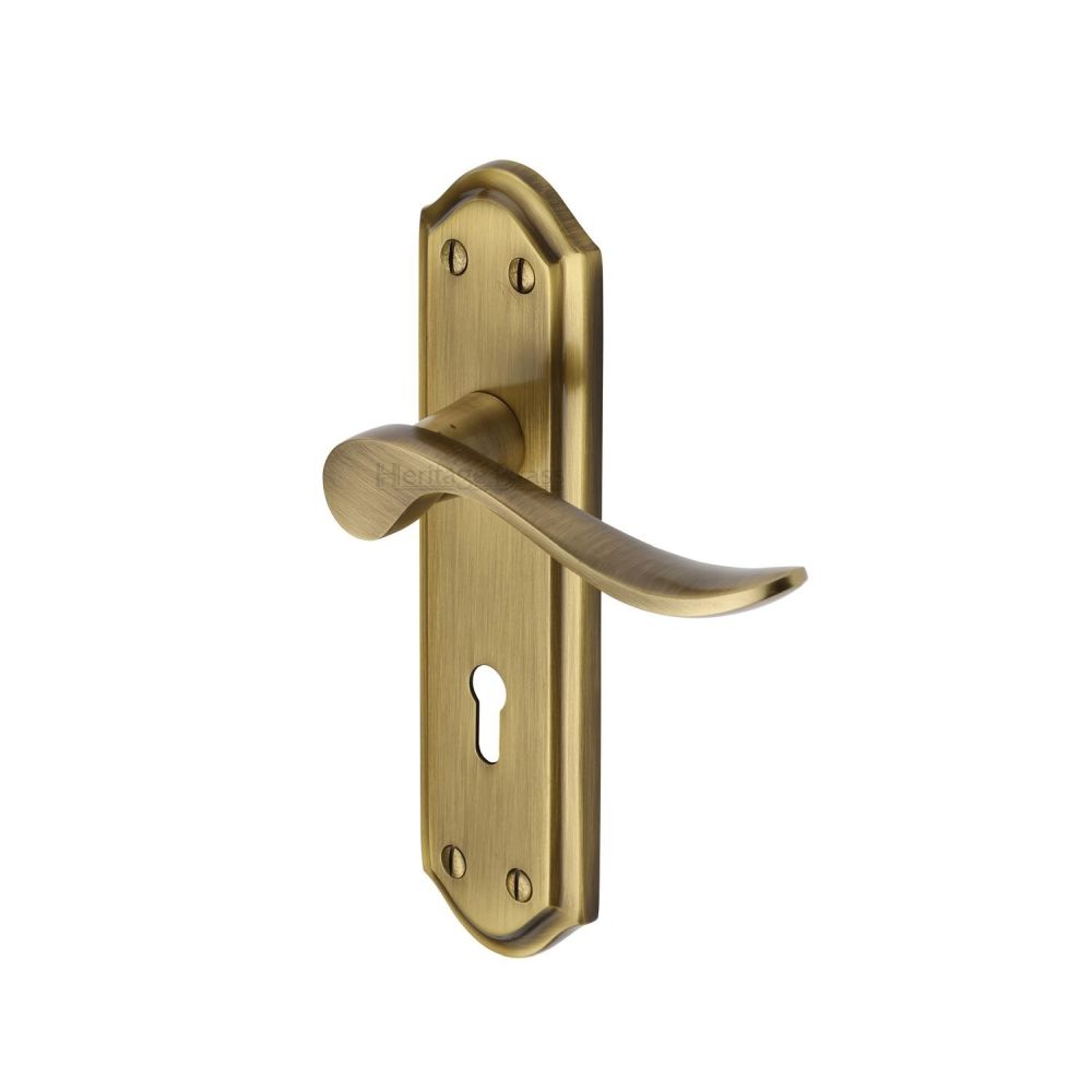 This is an image of a Heritage Brass - Door Handle Lever Lock Sandown Design Antique Brass Finish, san1400-at that is available to order from T.H Wiggans Ironmongery in Kendal.