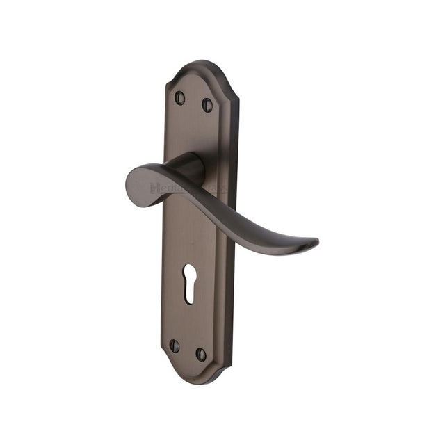 This is an image of a Heritage Brass - Door Handle Lever Lock Sandown Design Matt Bronze Finish, san1400-mb that is available to order from T.H Wiggans Ironmongery in Kendal.