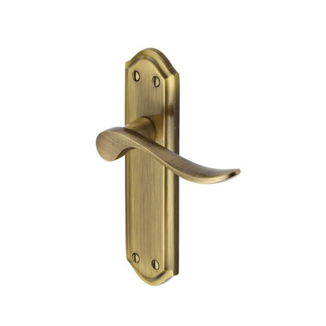 This is an image of a Heritage Brass - Door Handle Lever Latch Sandown Design Antique Brass Finish, san1410-at that is available to order from T.H Wiggans Ironmongery in Kendal.