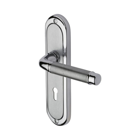 This is an image of a Heritage Brass - Door Handle Lever Lock Saturn Design Apollo Finish, sat1000-ap that is available to order from T.H Wiggans Ironmongery in Kendal.
