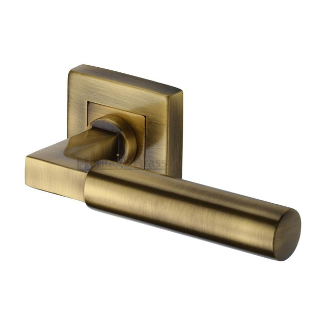 This is an image of a Heritage Brass - Door Handle Lever on Rose Bauhaus Sq Design Antique Brass Finish, sq1926-at that is available to order from T.H Wiggans Ironmongery in Kendal.