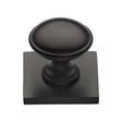 This is an image of a Heritage Brass - Cabinet Knob Domed Design with Square Backplate 32mm Matt Bronz, sq3950-mb that is available to order from T.H Wiggans Ironmongery in Kendal.