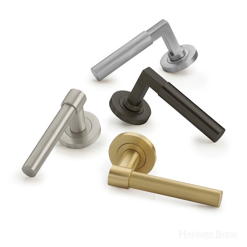 Image showing a selection of door handles by Heritage Brass, available to order from T.H Wiggans Ironmongery in Kendal