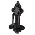 This is an image of a The Tudor Collection - Ornate Knocker Black Iron, tc539 that is available to order from T.H Wiggans Ironmongery in Kendal.