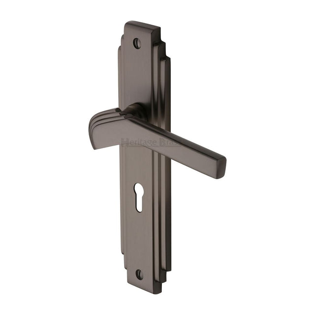This is an image of a Heritage Brass - Door Handle Lever Lock Tiffany Design Matt Bronze Finish, tif5200-mb that is available to order from T.H Wiggans Ironmongery in Kendal.