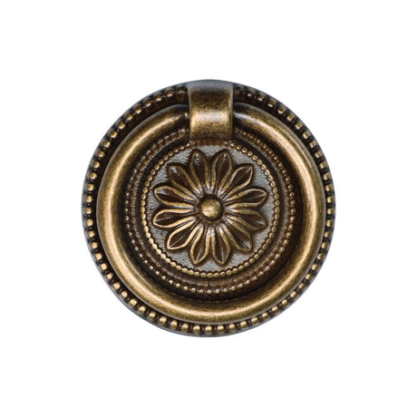 This is an image of a M.Marcus - Floral Ring Pull 055mm Distressed Brass Finish, tk2224-055-dbs that is available to order from T.H Wiggans Ironmongery in Kendal.