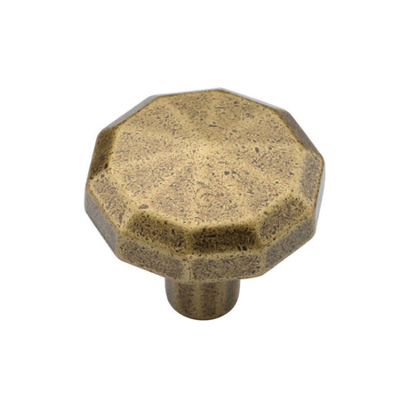 This is an image of a M.Marcus - Terre Cabinet Knob 032mm Distressed Brass Finish, tk4231-032-dbs that is available to order from T.H Wiggans Ironmongery in Kendal.