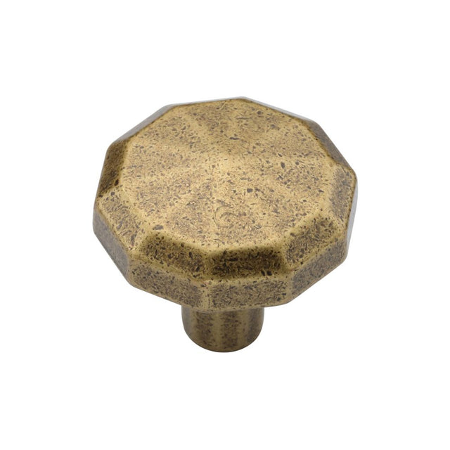 This is an image of a M.Marcus - Terre Cabinet Knob 032mm Distressed Brass Finish, tk4231-032-dbs that is available to order from T.H Wiggans Ironmongery in Kendal.