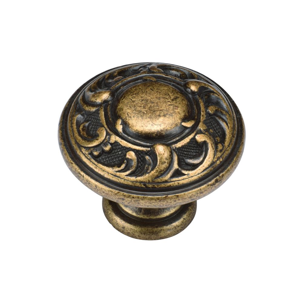 This is an image of a M.Marcus - Decorated Round Knob 035mm Distressed Brass Finish, tk4401-035-dbs that is available to order from T.H Wiggans Ironmongery in Kendal.