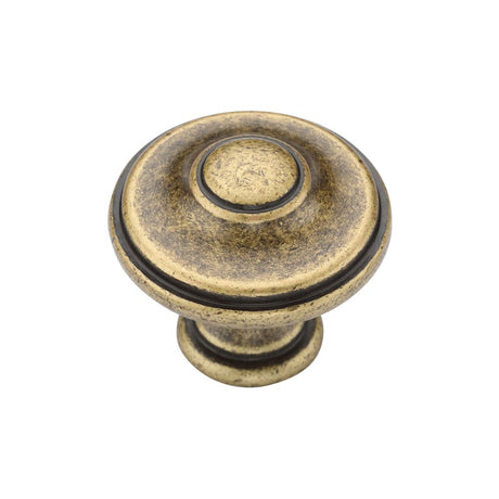 This is an image of a M.Marcus - Domed Round Knob 030mm Distressed Brass Finish, tk4408-030-dbs that is available to order from T.H Wiggans Ironmongery in Kendal.