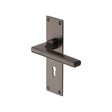 This is an image of a Heritage Brass - Door Handle Lever Lock Trident Design Matt Bronze Finish, tri1300-mb that is available to order from T.H Wiggans Ironmongery in Kendal.