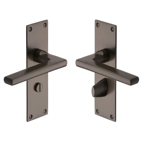 This is an image of a Heritage Brass - Door Handle Bathroom Set Trident Design Matt Bronze Finish, tri1330-mb that is available to order from T.H Wiggans Ironmongery in Kendal.