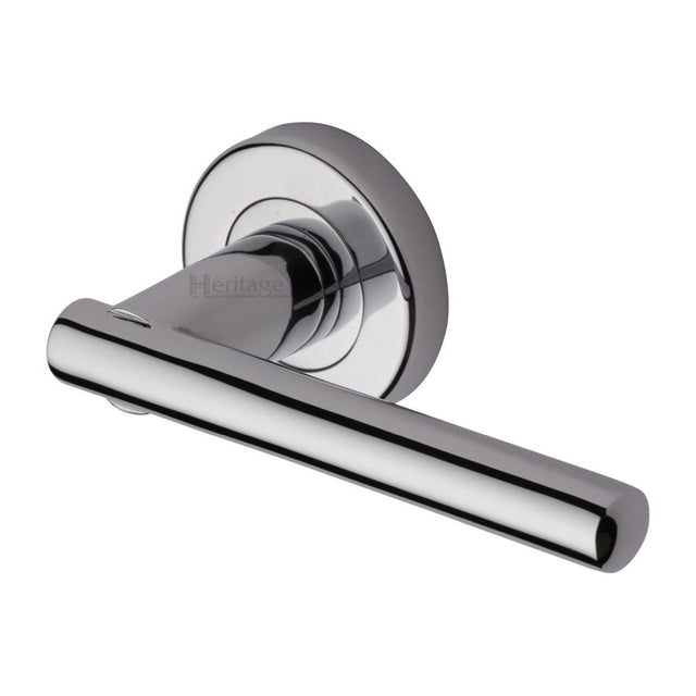 This is an image of a Heritage Brass - Door Handle Lever Latch on Round Rose Challenger Design Polished Ch, v1001-pc that is available to order from T.H Wiggans Ironmongery in Kendal.