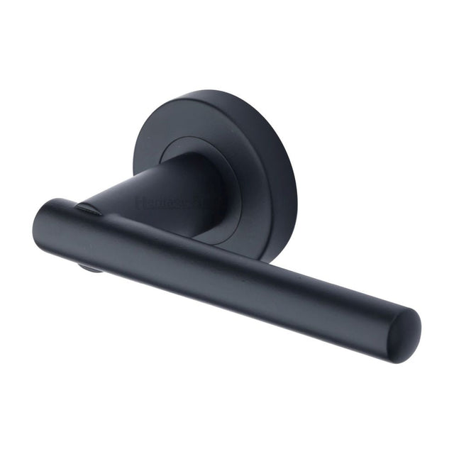 This is an image of a Heritage Brass - Door Handle Lever on Rose Challenger Design Matt Black Finish, v1001-bkmt that is available to order from T.H Wiggans Ironmongery in Kendal.