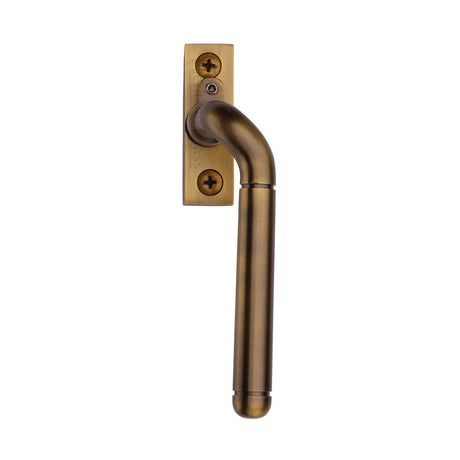 This is an image of a Heritage Brass - Lockable Espagnolette Right Handed Antique Brass finish, v1006l-rh-at that is available to order from T.H Wiggans Ironmongery in Kendal.