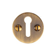 This is an image of a Heritage Brass - Keyhole Escutcheon Antique Brass Finish, v1010-at that is available to order from T.H Wiggans Ironmongery in Kendal.