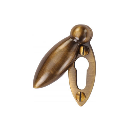 This is an image of a Heritage Brass - Covered Keyhole Oval Antique Brass Finish, v1022-at that is available to order from T.H Wiggans Ironmongery in Kendal.