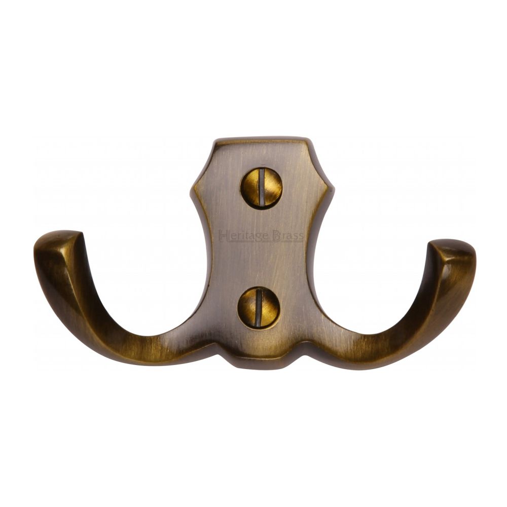 This is an image of a Heritage Brass - Double Coat Hook Antique Brass Finish, v1062-at that is available to order from T.H Wiggans Ironmongery in Kendal.