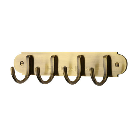 This is an image of a Heritage Brass - Coat Hooks on Plate Antique Brass Finish, v1079-at that is available to order from T.H Wiggans Ironmongery in Kendal.