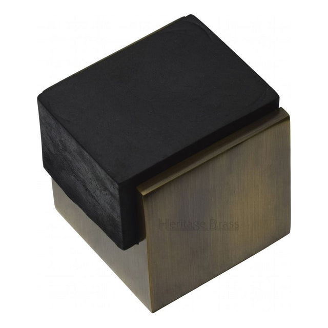 This is an image of a Heritage Brass - Door Stop Square Floor Mounted Design Antique Brass Finish, v1082-at that is available to order from T.H Wiggans Ironmongery in Kendal.