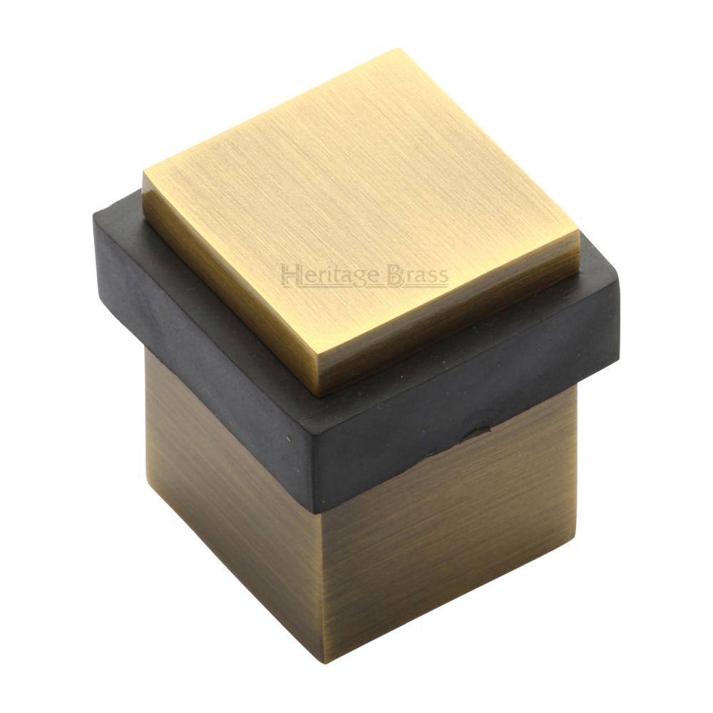 This is an image of a Heritage Brass - Door Stop Square Floor Mounted Design Antique Brass Finish, v1089-at that is available to order from T.H Wiggans Ironmongery in Kendal.