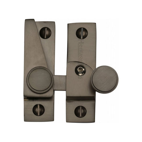 This is an image of a Heritage Brass - Sash Fastener Lockable Matt Bronze Finish, v1106l-mb that is available to order from T.H Wiggans Ironmongery in Kendal.