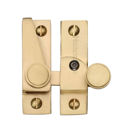 This is an image of a Heritage Brass - Sash Fastener Lockable Satin Brass Finish, v1106l-sb that is available to order from T.H Wiggans Ironmongery in Kendal.