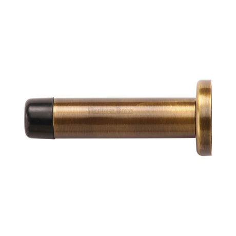 This is an image of a Heritage Brass - Projection Door Stop 2 1/2" Antique Brass Finish, v1192-64-at that is available to order from T.H Wiggans Ironmongery in Kendal.