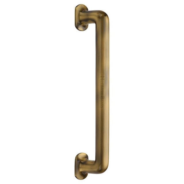 This is an image of a Heritage Brass - Door Pull Handle Traditional Design 330mm Antique Brass Finish, v1376-330-at that is available to order from T.H Wiggans Ironmongery in Kendal.