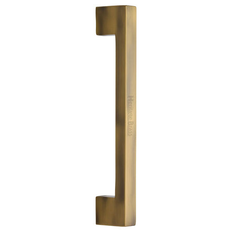 This is an image of a Heritage Brass - Door Pull Handle Urban Design 305mm Antique Brass Finish, v1390-305-at that is available to order from T.H Wiggans Ironmongery in Kendal.