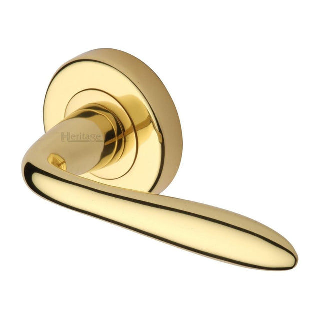 This is an image of a Heritage Brass - Door Handle Lever Latch on Round Rose Sutton Design Polished Brass, v1750-pb that is available to order from T.H Wiggans Ironmongery in Kendal.