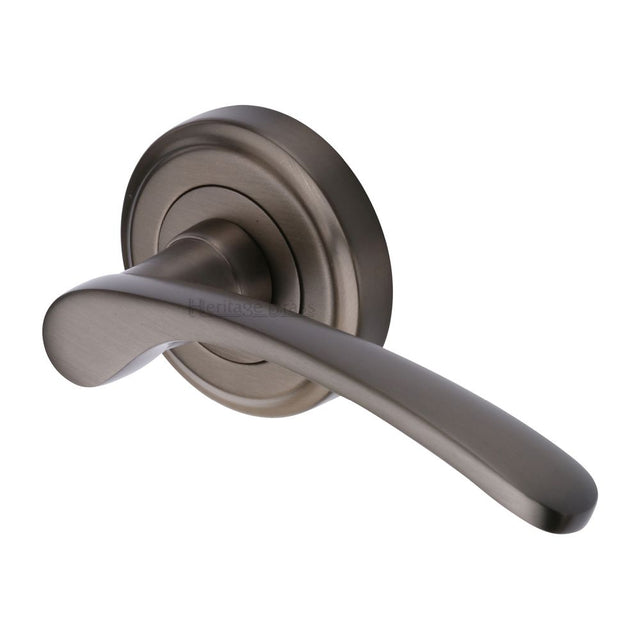 This is an image of a Heritage Brass - Door Handle Lever Latch on Round Rose Sophia Design Matt Bronze, v1900-mb that is available to order from T.H Wiggans Ironmongery in Kendal.