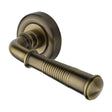 This is an image of a Heritage Brass - Door Handle Lever Latch on Round Rose Colonial Reeded Design An, v1936-at that is available to order from T.H Wiggans Ironmongery in Kendal.