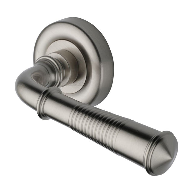 This is an image of a Heritage Brass - Door Handle Lever Latch on Round Rose Colonial Reeded Design Sa, v1936-sn that is available to order from T.H Wiggans Ironmongery in Kendal.